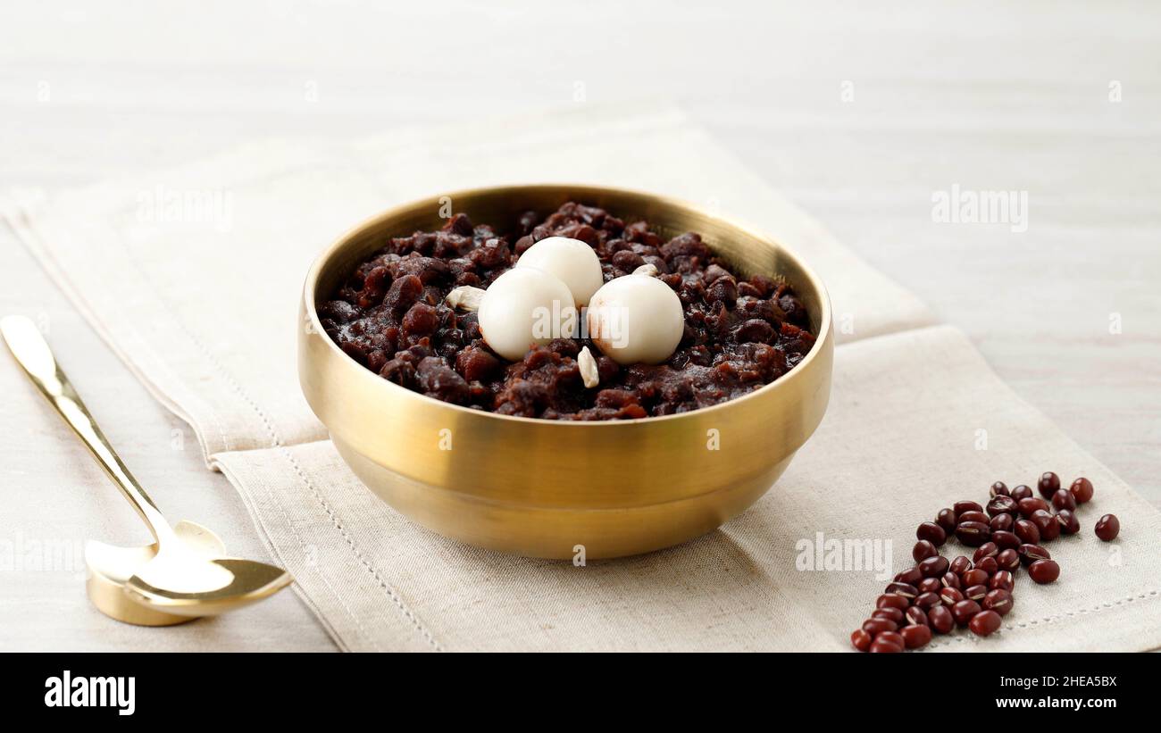 Korean Traditional Food Red Bean Porridge with Rice Cake, Popular as Patjuk Dongji Stock Photo