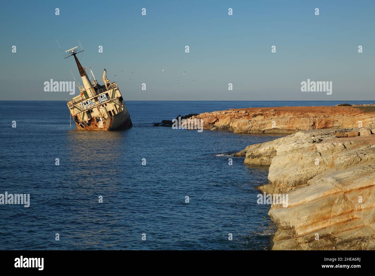 Old rusty ship vessel abandoned on Cyprus coast after an accident, nobody Stock Photo