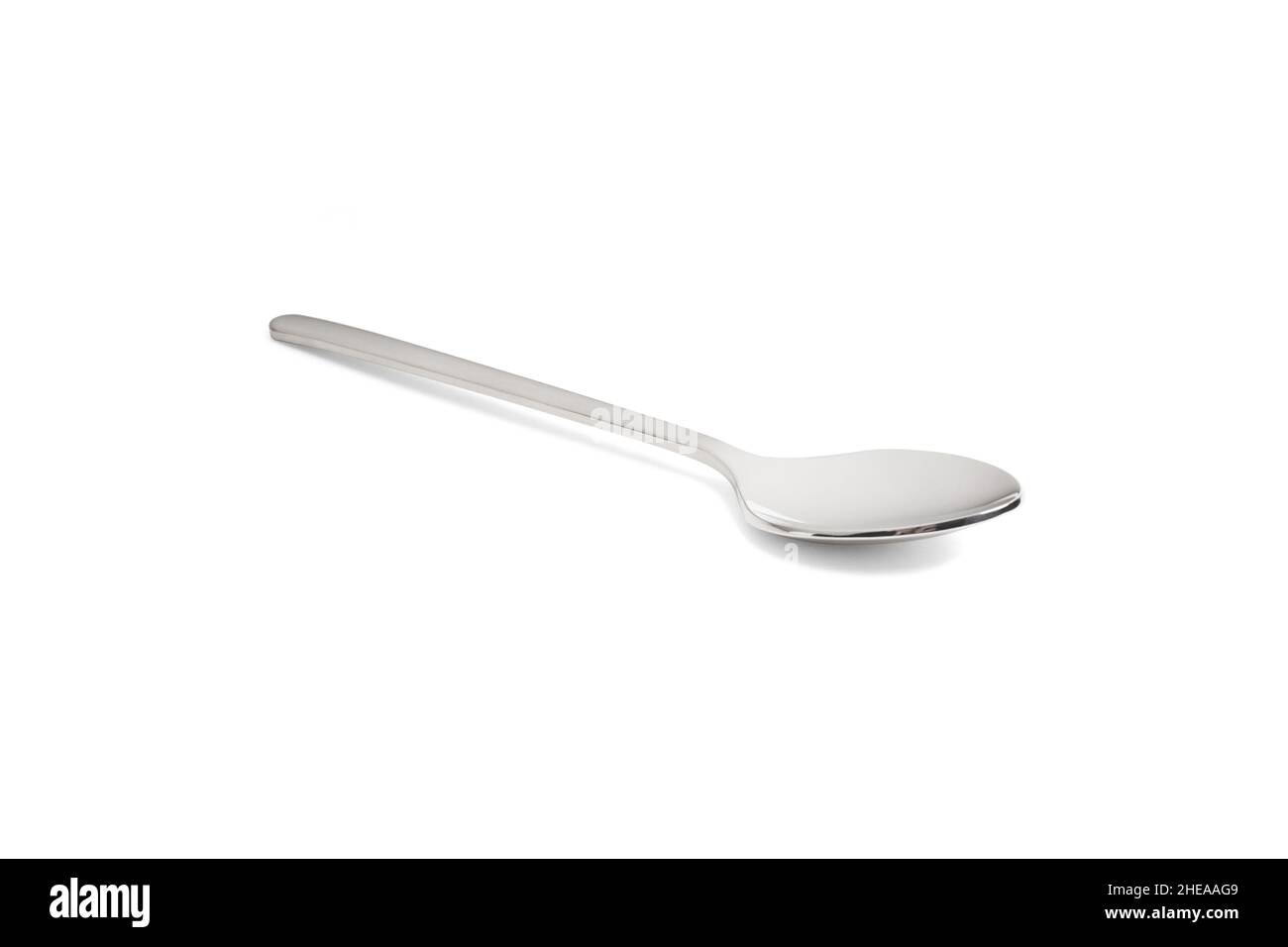 Clean shiny metal spoon isolated on white. Stainless steel small