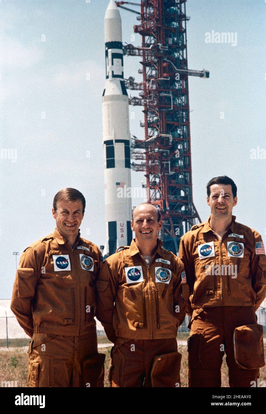 (4 May 1973) --- The three prime crew members of the first manned Skylab mission (Skylab 2) are photographed at Launch Complex 39, Kennedy Space Center, during preflight activity. They are, left to right, astronaut Paul J. Weitz, pilot; astronaut Charles Conrad Jr., commander; and scientist-astronaut Joseph P. Kerwin, science pilot. In the background is the Skylab 1/Saturn V space vehicle with its Skylab space station payload on Pad A Stock Photo