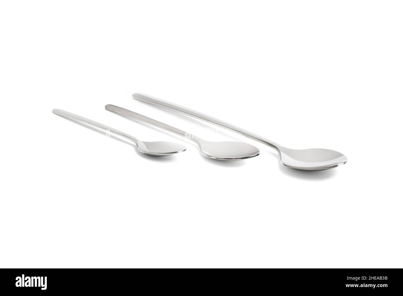 Clean shiny metal spoon isolated on white. Stainless steel small