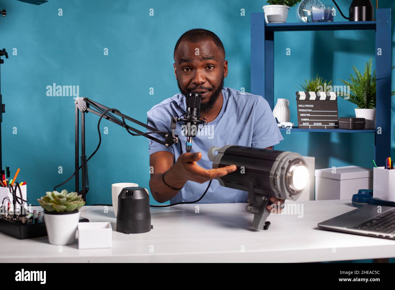 Influencer talking into microphone about continous lighting equipment