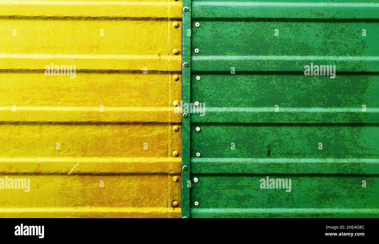 Yellow and green painted metal with rust texture Stock Photo