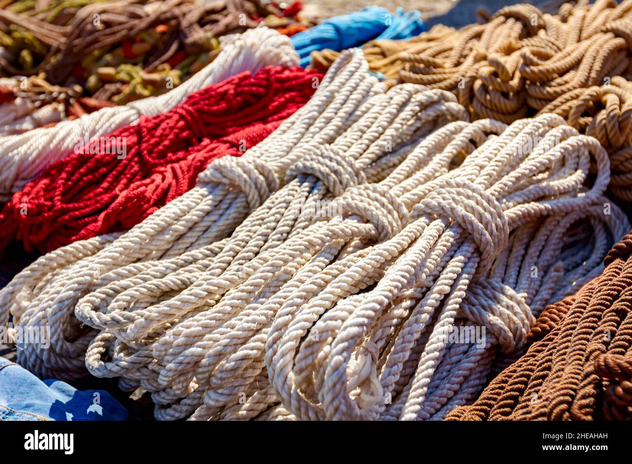 Close up shot of heap of braided hemp ropes made for sale at outdoor