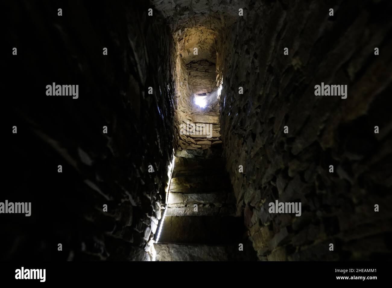 Narrow stone steps inside a medieval tower in a fortified church in the Transylvania region of Romania. Stock Photo