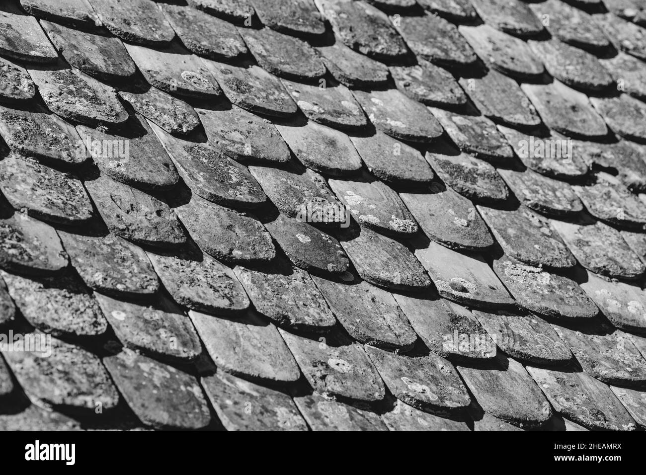 Shallow depth of field (selective focus) details of Transylvanian saxon traditional clay tiles. Stock Photo