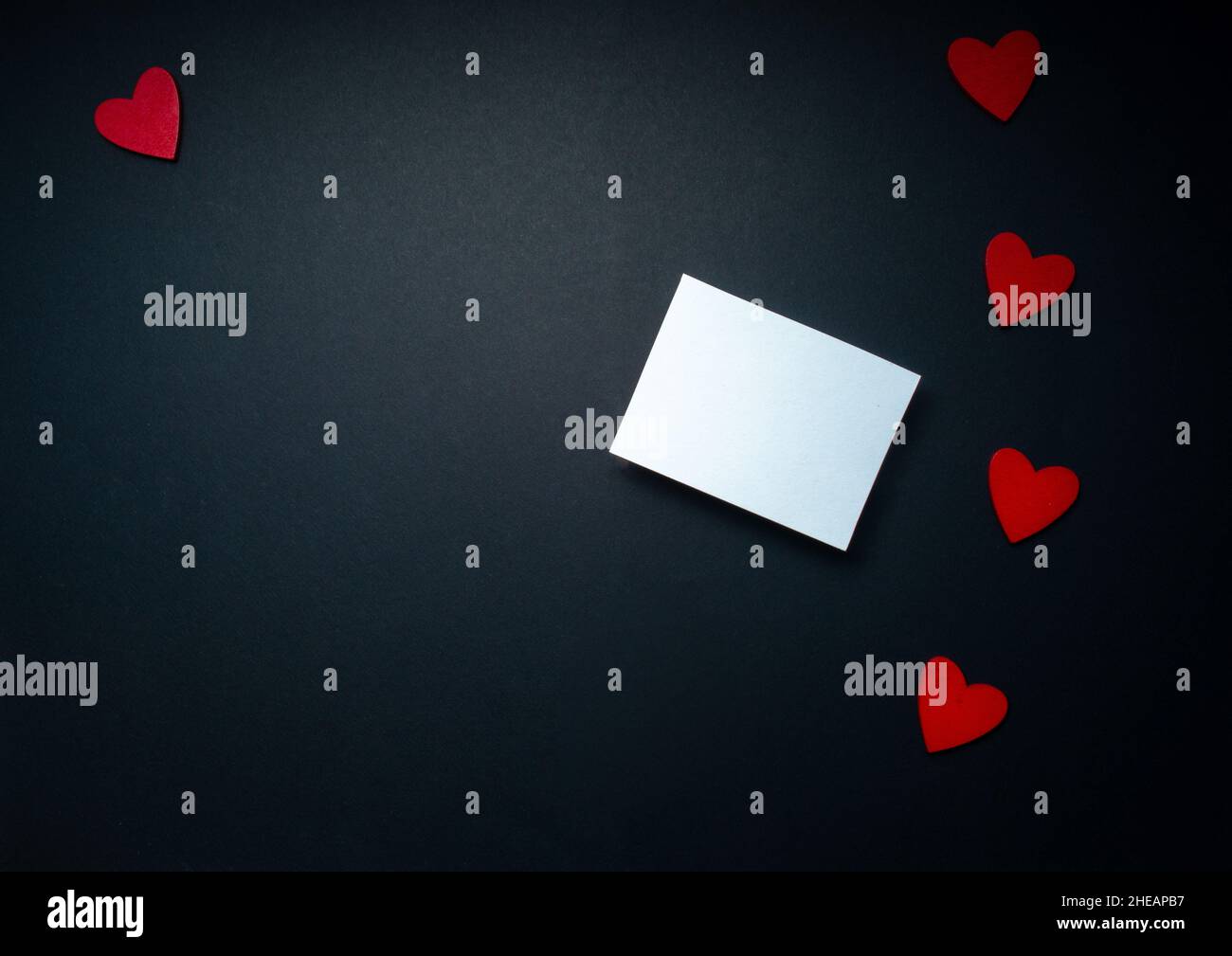 romantic valentine mock up with white note or card on black background ...