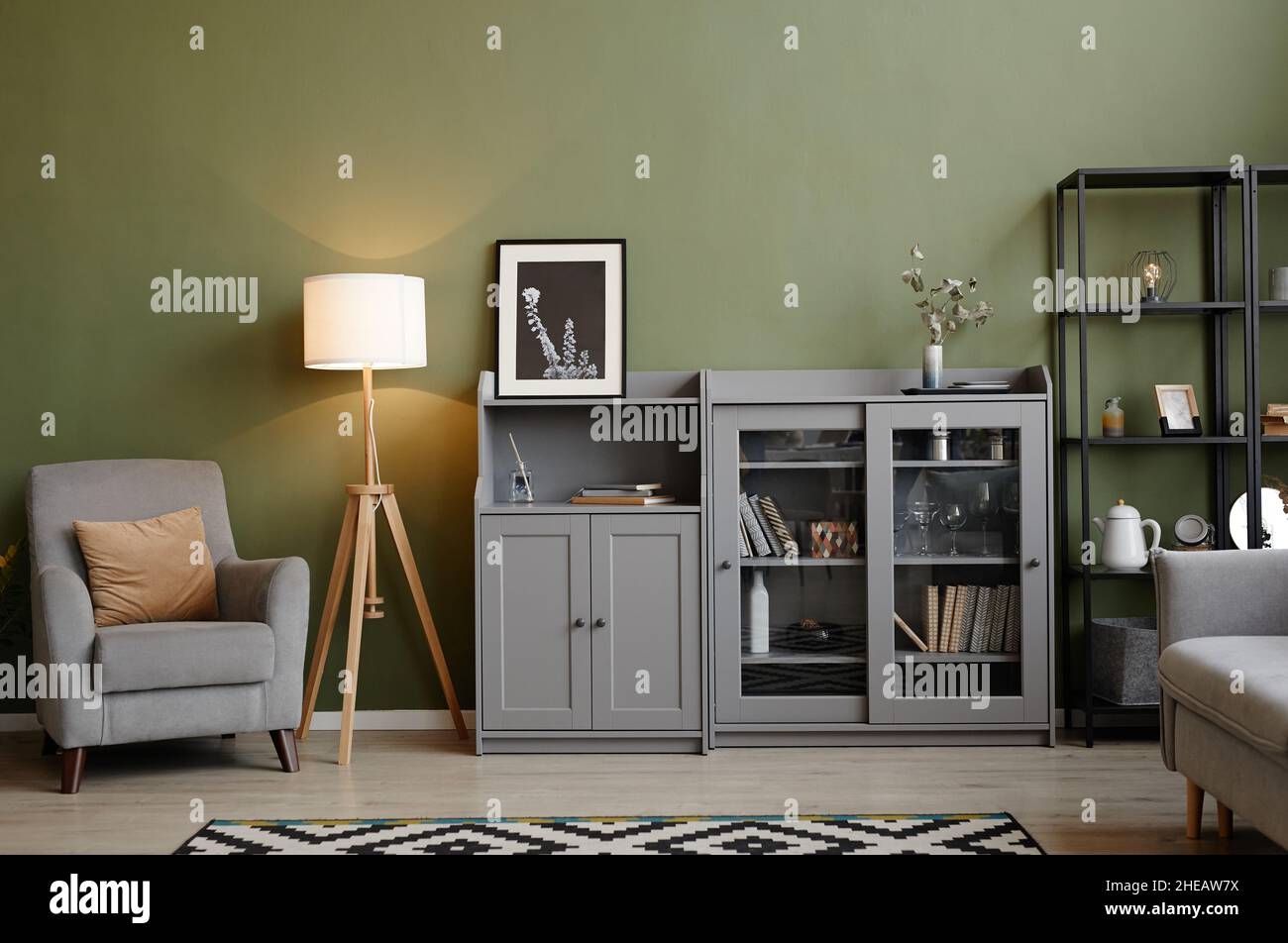 Image of modern living room with armchair, lamp and bookcase in the ...
