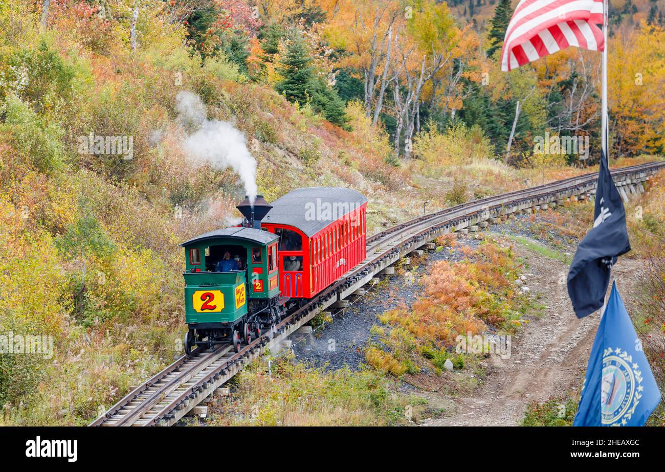 Vintage steam train with smoke climbing the Mount Washington Cog Railway, Mount Washington, New Hampshire, New England, USA Stock Photo