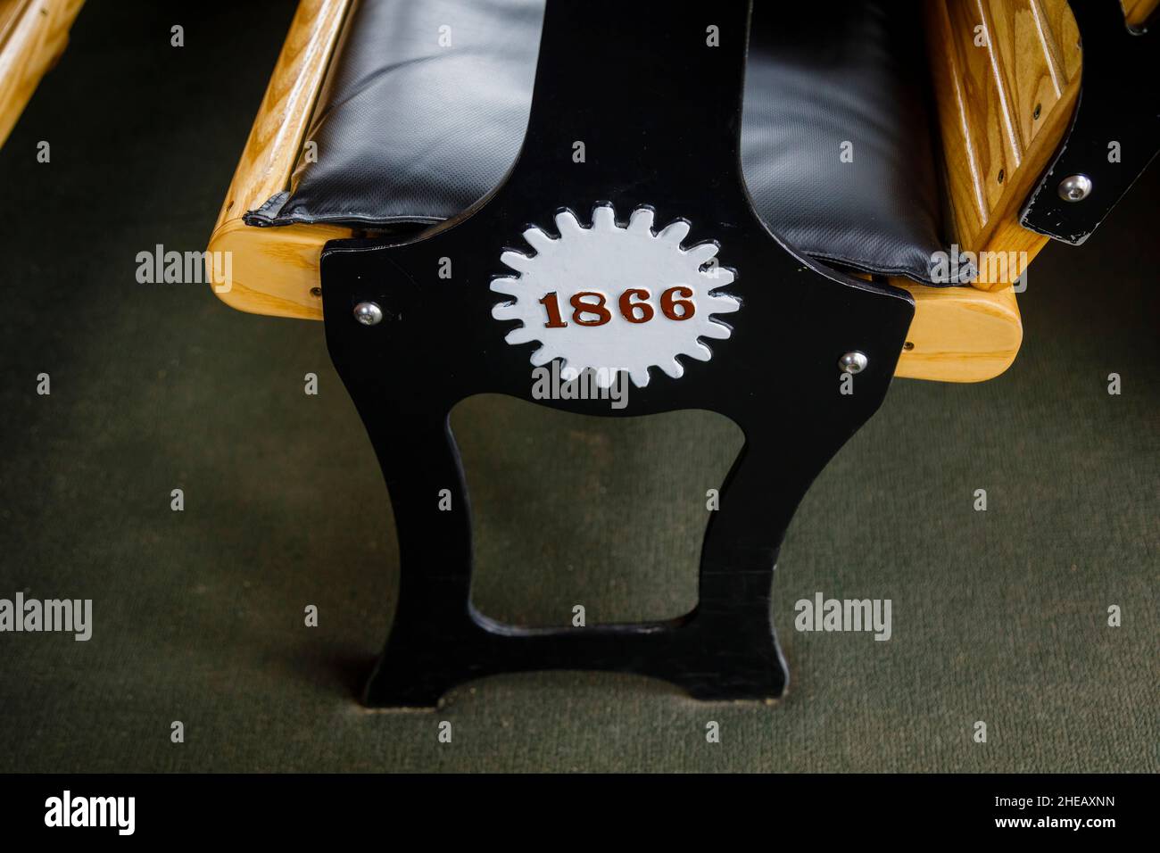 Bench seats marked '1866' on cogs in a carriage of the Mount Washington Cog Railway, Mount Washington, New Hampshire, New England, USA Stock Photo