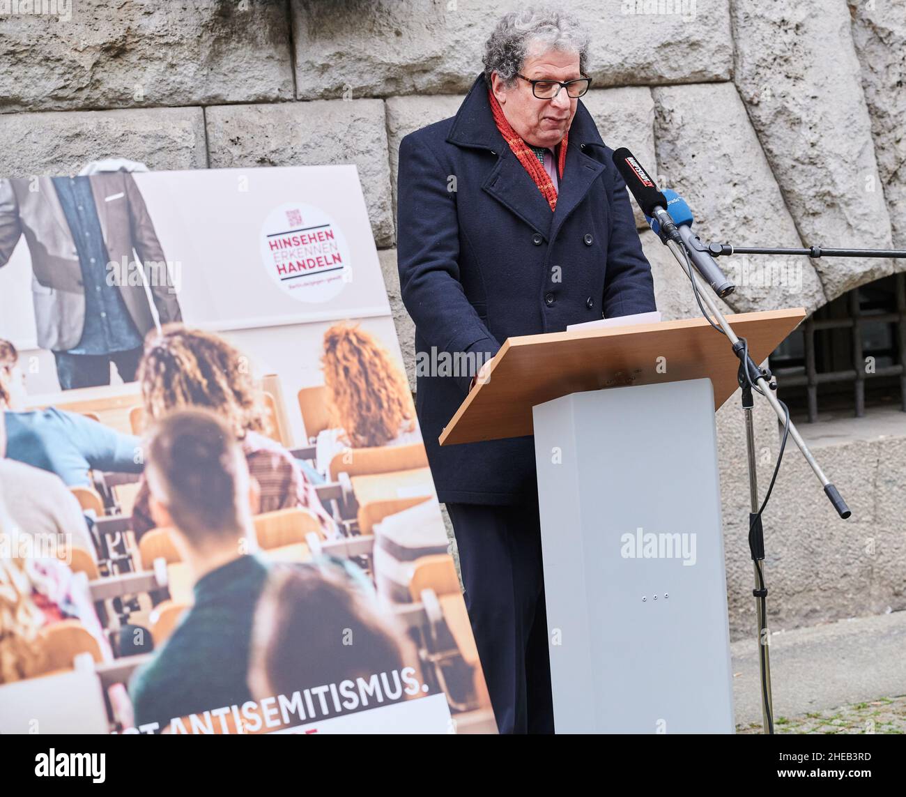 Berlin, Germany. 10th Jan, 2022. Sigmount A. Königsberg (M), representative of the Jewish Community of Berlin, speaks at the presentation of the poster campaign 'This is anti-Semitism' next to a poster with the inscription 'Hinsehen Erkennen Handeln'. Credit: Annette Riedl/dpa/Alamy Live News Stock Photo