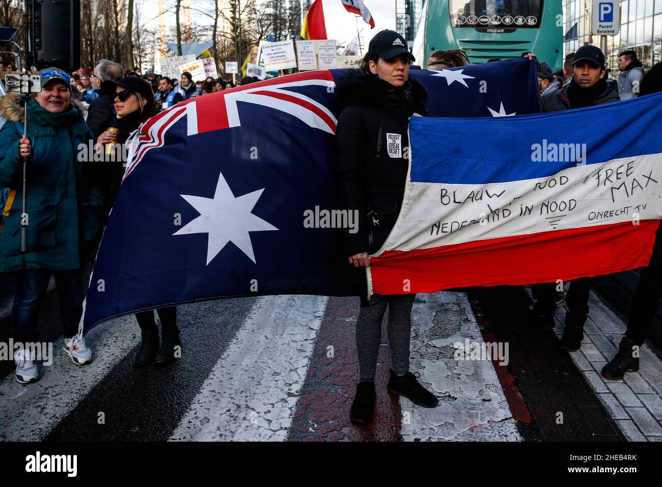 Brussels, Belgium. 9th Jan, 2022. Protesters hold an Australian flag during a demonstration against mandatory Covid-19 vaccination and other government measures to contain the spread of Covid-19 in Brussels, Belgium, January 9, 2022. (Credit Image: © Valeria Mongelli/ZUMA Press Wire) Stock Photo