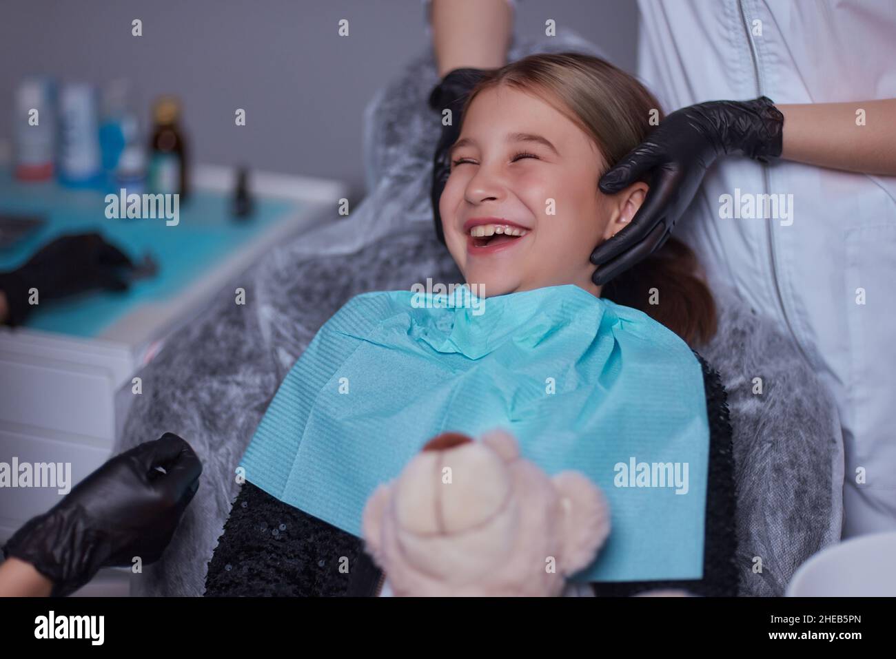 Dentist use anesthetic injection for tooth extraction in child Stock