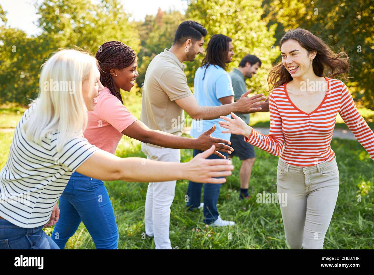 Group of friends in the park with the splash as a symbol of team ...