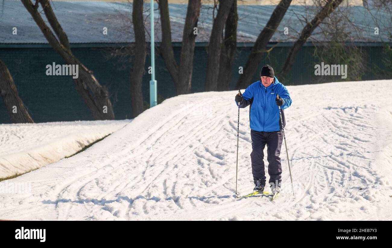 Elderly man walking skiing hi-res stock photography and images - Alamy