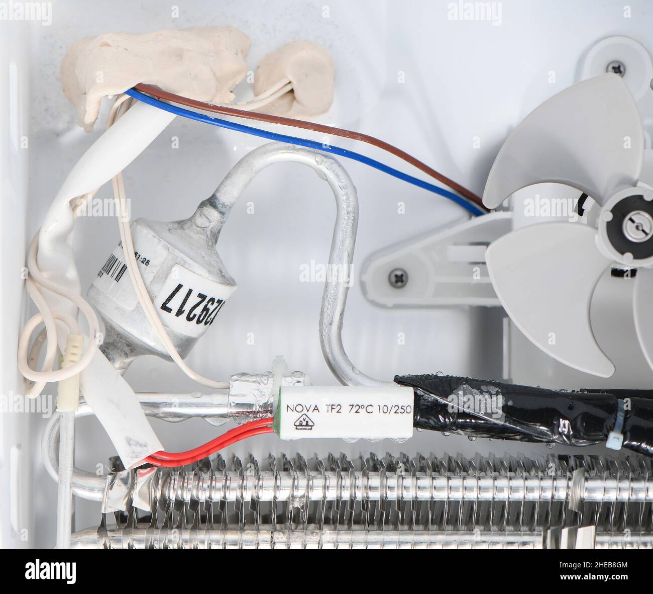 Inside of a freezer showing fan unit and evaporator parts Stock Photo