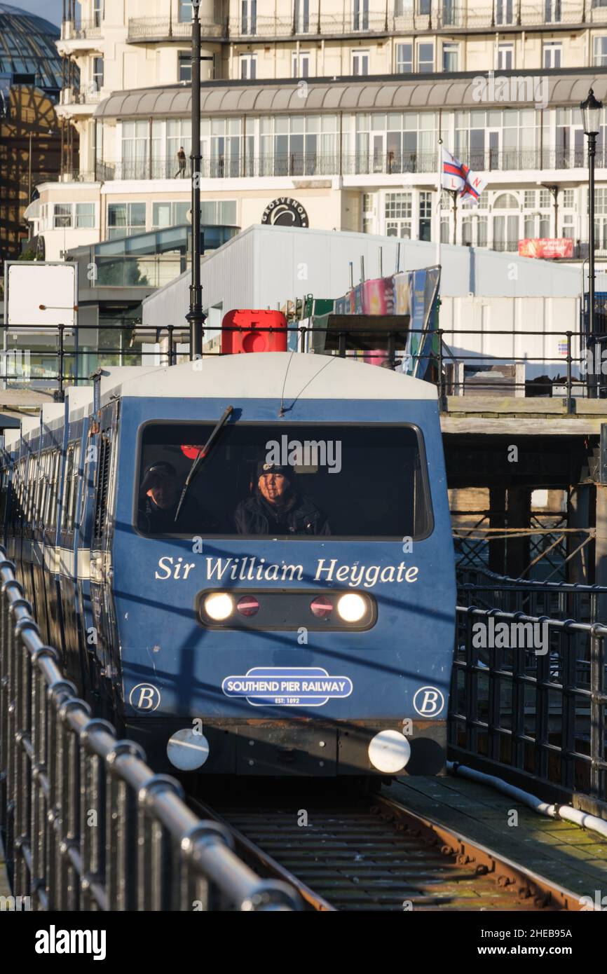 Pier train leaving shoreside platform. Stock Photo