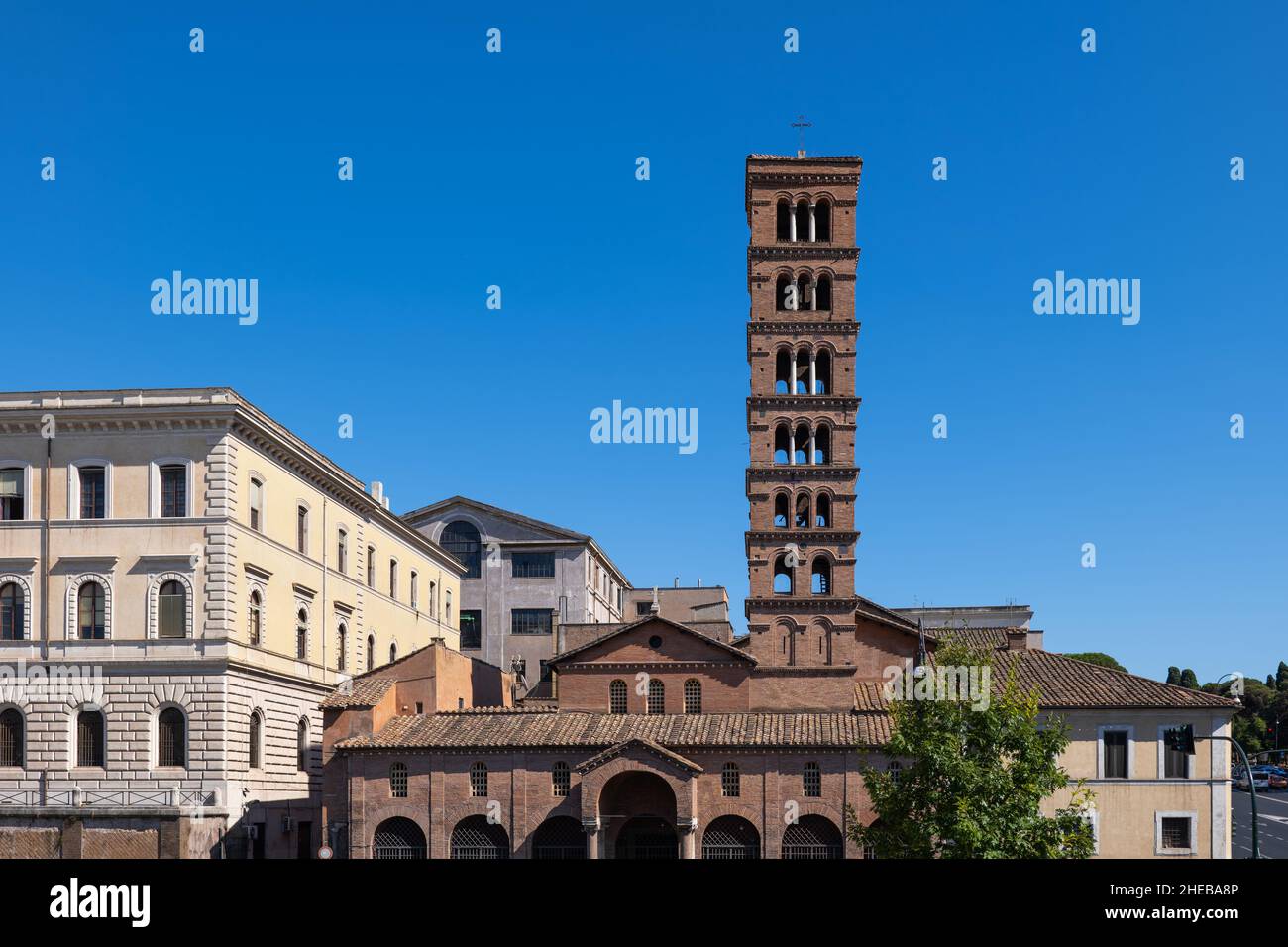 Basilica of Saint Mary in Cosmedin with medieval bell tower in Rome, Italy. Stock Photo