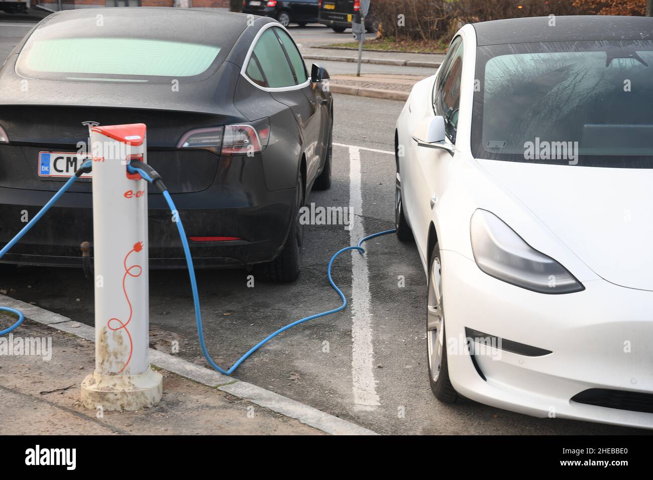 Copenhagen/Denmark./10 Januaryr 2022/  Tesla cars and othee electric cara  recharging at charge point in danish capital Copenhagen.  (Photo..Francis Joseph Dean/Dean Pictures) Stock Photo