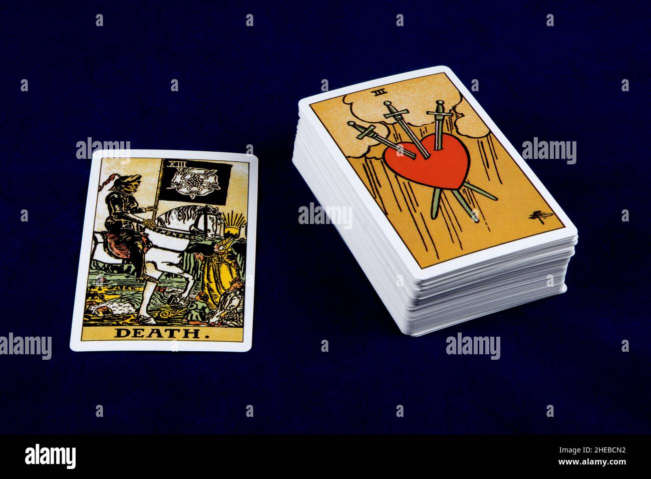 Single tarot card with deck of tarot cards isolated on a dark blue