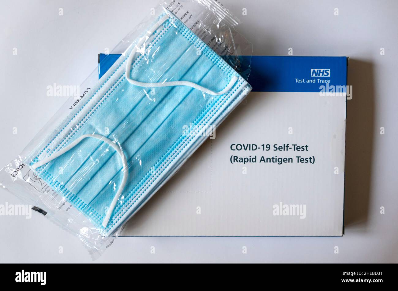 Surgical face masks with a Covid19 NHS Rapid Antigen Testing Kit Stock