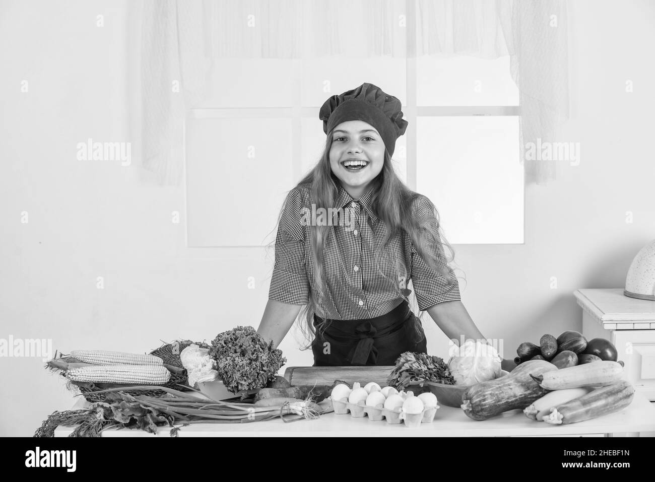 happy child prepares vegetable salad in kitchen, healthy eating Stock ...