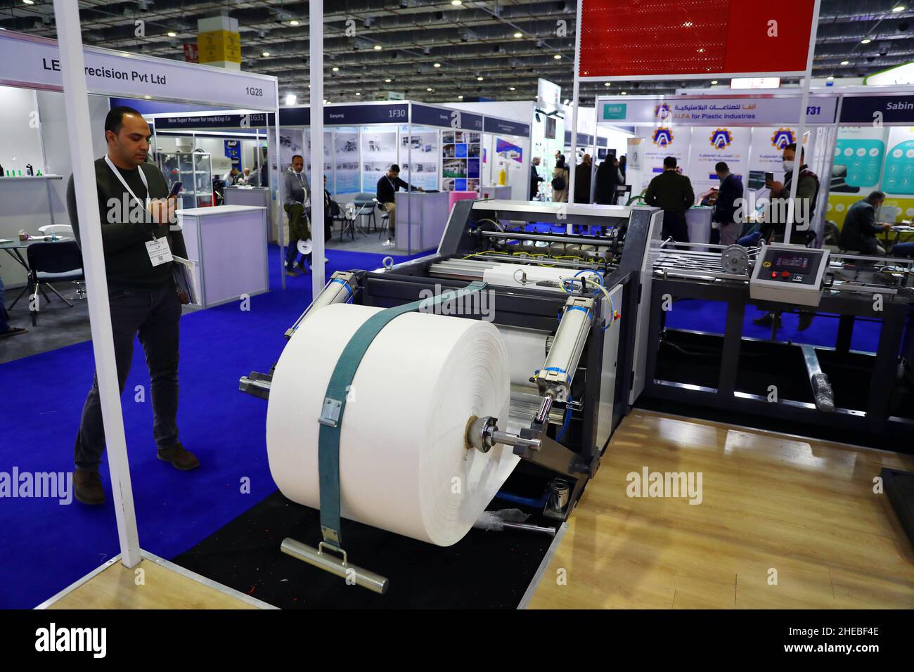 Cairo, Egypt. 9th Jan, 2022. A visitor takes photos at the International Plastics Exhibition in Cairo, Egypt, on Jan. 9, 2022. More than 300 plastics industry firms from over 20 countries gathered in the Egyptian capital Cairo to showcase their raw materials, machinery, and semi-finished products in Egypt's 18th International Plastics Exhibition (PLASTEX). Credit: Ahmed Gomaa/Xinhua/Alamy Live News Stock Photo