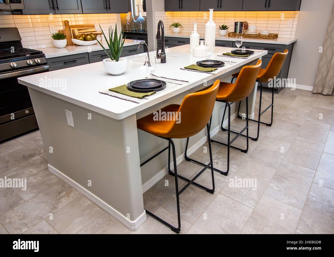 Kitchen Island With Sink, Decorator Items And Place Settings Stock