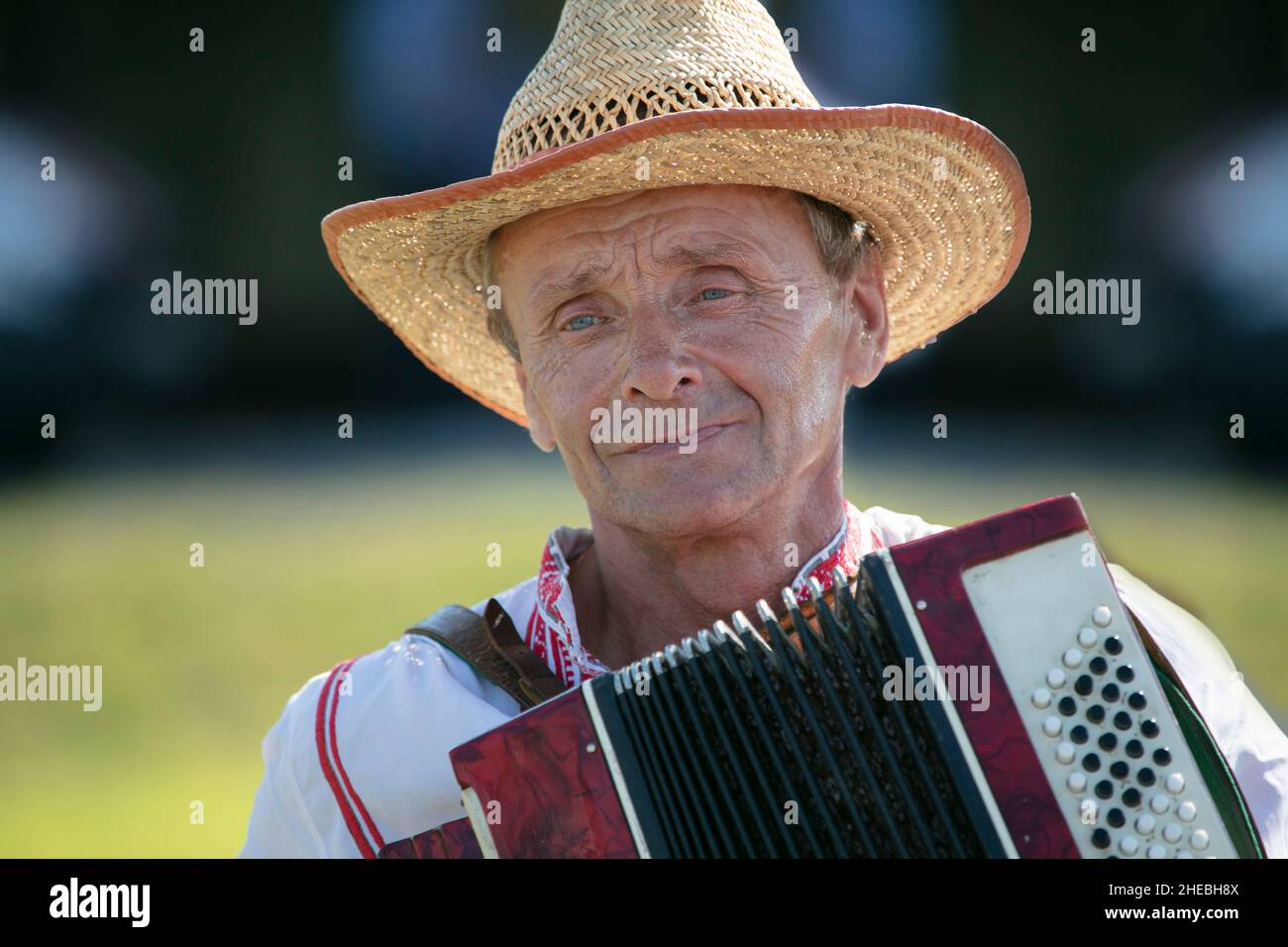 A Holiday Of Humor A Slavic Belarusian Or Ukrainian Man In A Straw Hat a-holiday-of-humor-a-slavic-belarusian-or-ukrainian-man-in-a-straw-hat