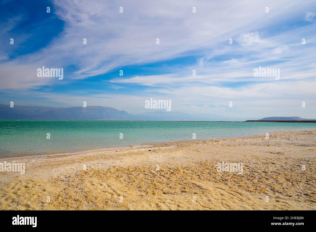 water level receding and salt crystallization due to evaporation on the shores of the Dead Sea, Israel Stock Photo