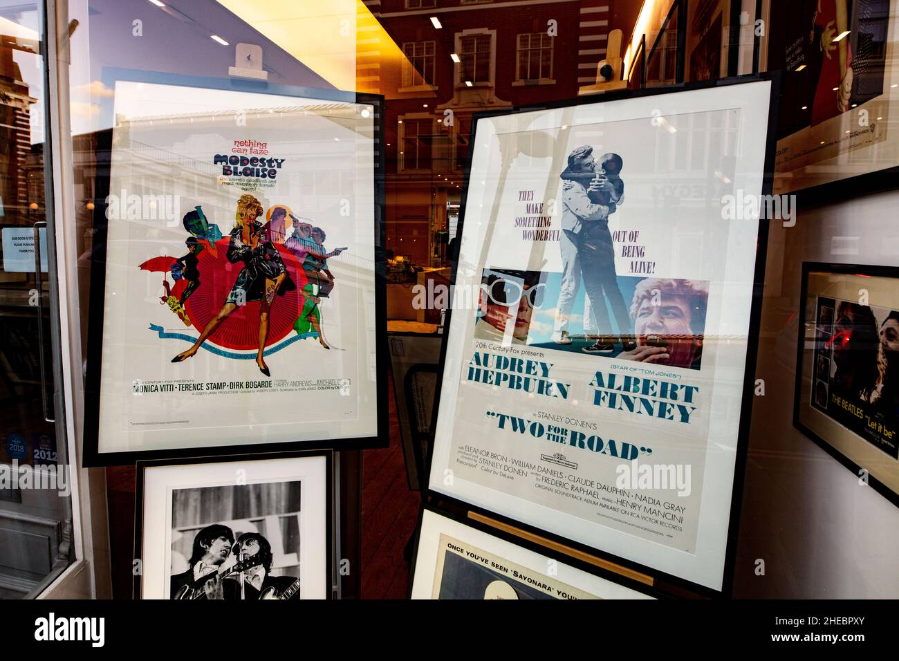A series of framed film advertising posters in a shop n the Fulham Rd