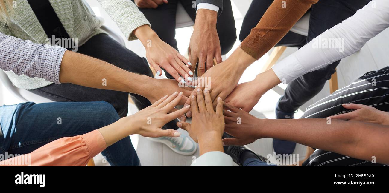 Closeup banner of diverse people stack hands Stock Photo - Alamy