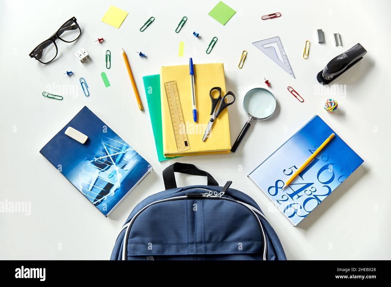 blue backpack with books and school supplies Stock Photo
