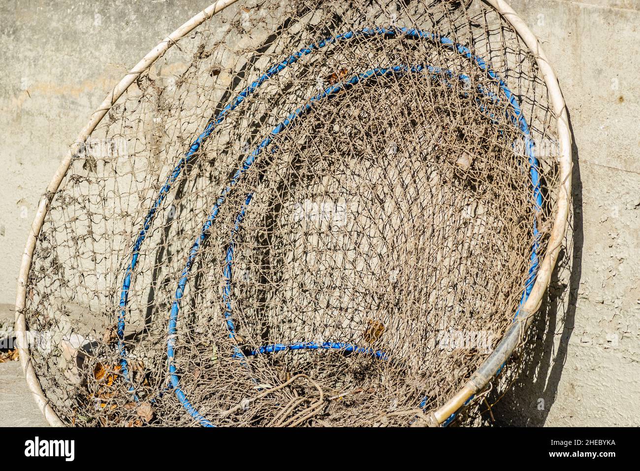 Leaning gathered fishing net to catch fish Stock Photo Alamy