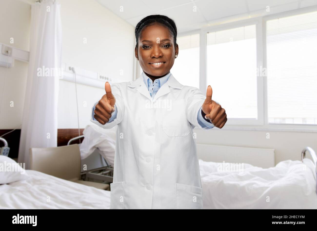 Thumbs up african doctor white hi-res stock photography and images - Alamy