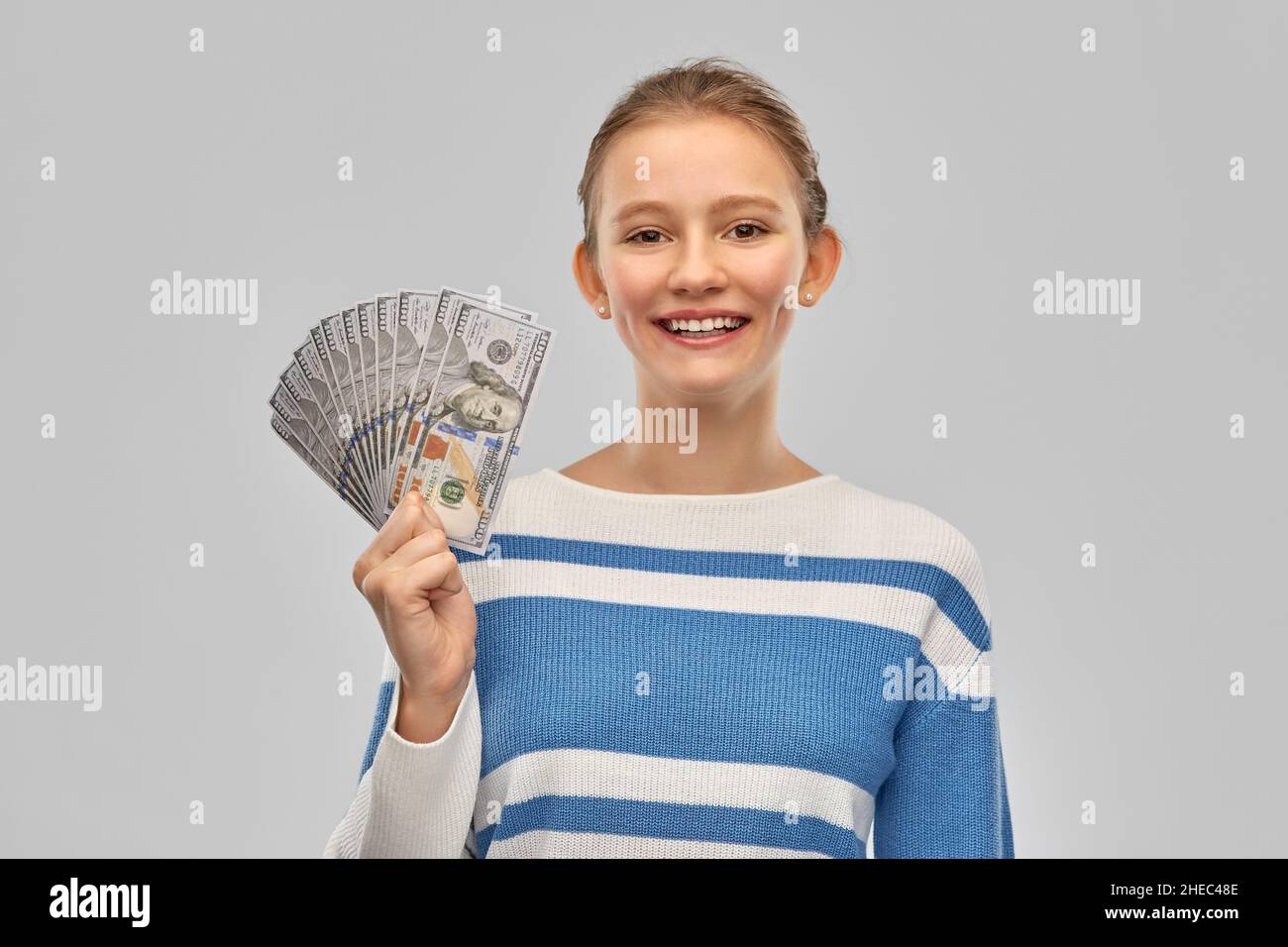 smiling teenage girl with dollar money banknotes Stock Photo