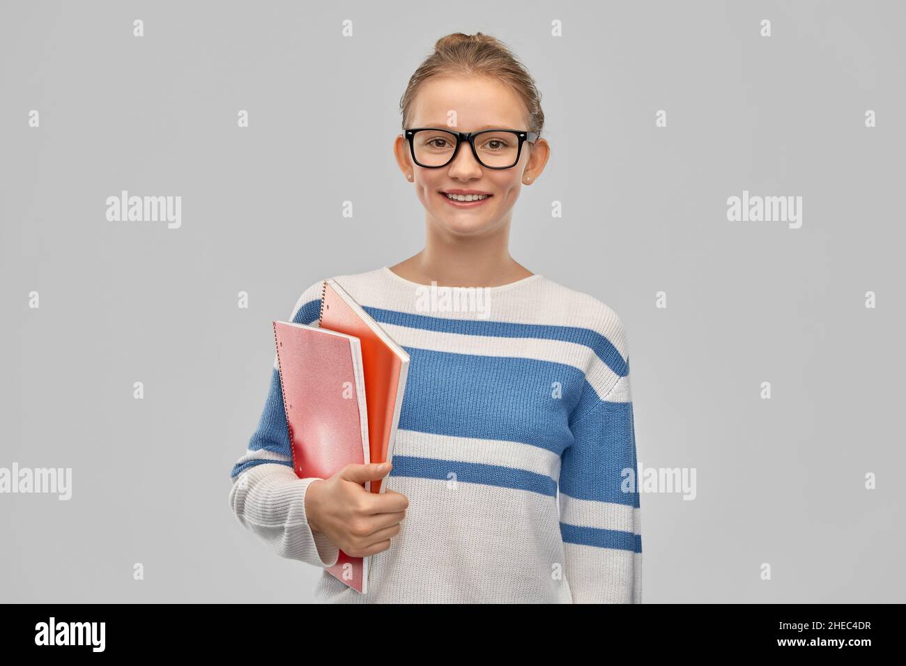 happy smiling teenage student girl with notebooks Stock Photo - Alamy