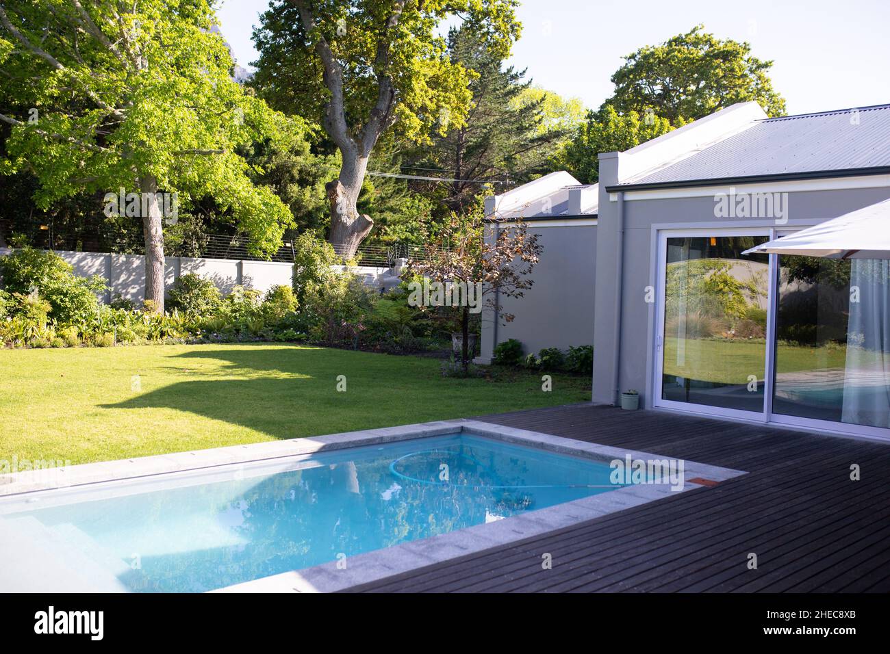 View of modern house exterior with swimming pool and lawn Stock Photo