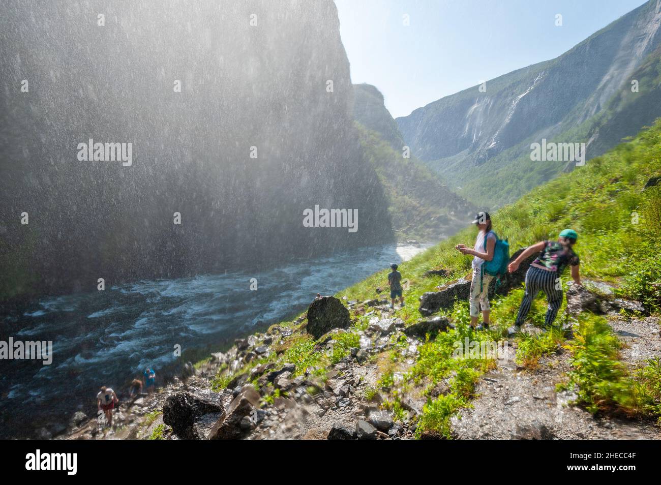 Hiking underneath the Voringfossen waterfall, Hordaland, Norway Stock Photo