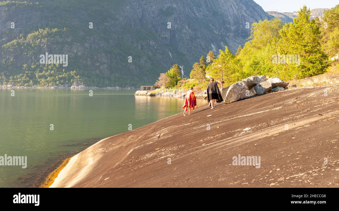 Kids with towels after swimming in the fjord, Eidfjord, Norway Stock Photo