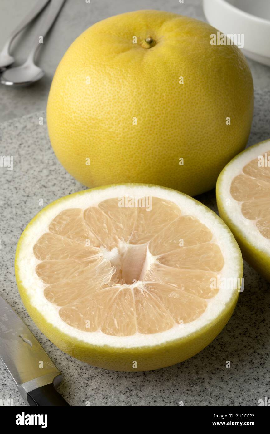 Whole and halved Sweetie citrus fruit close up Stock Photo