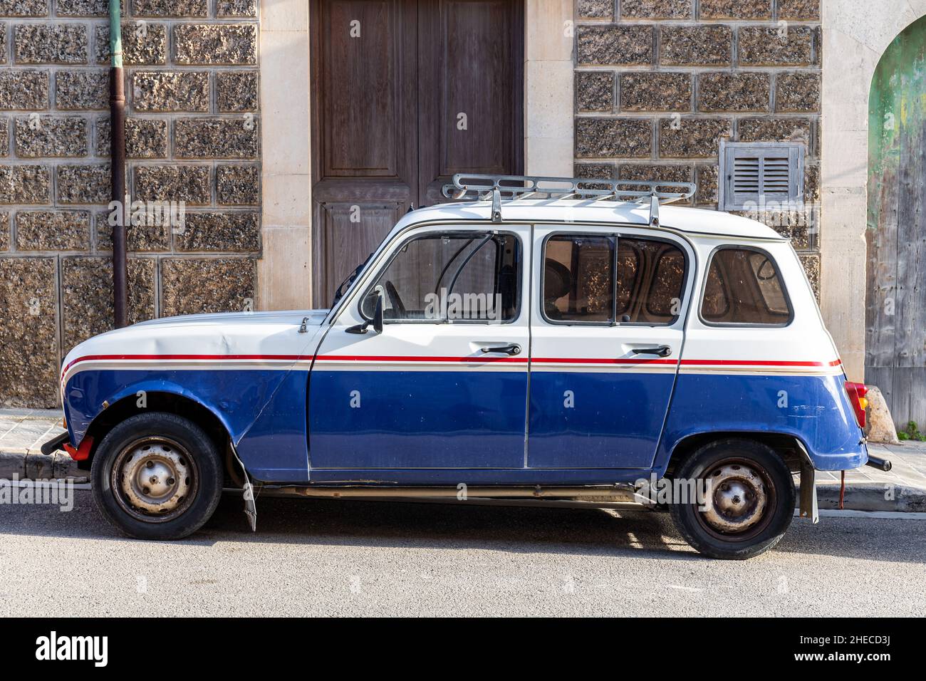 Renault 4, also R4 or 4L or Quatrelle, with a roof rack, in a town in Majorca, Mallorca, Balearic Islands, Spain Stock Photo