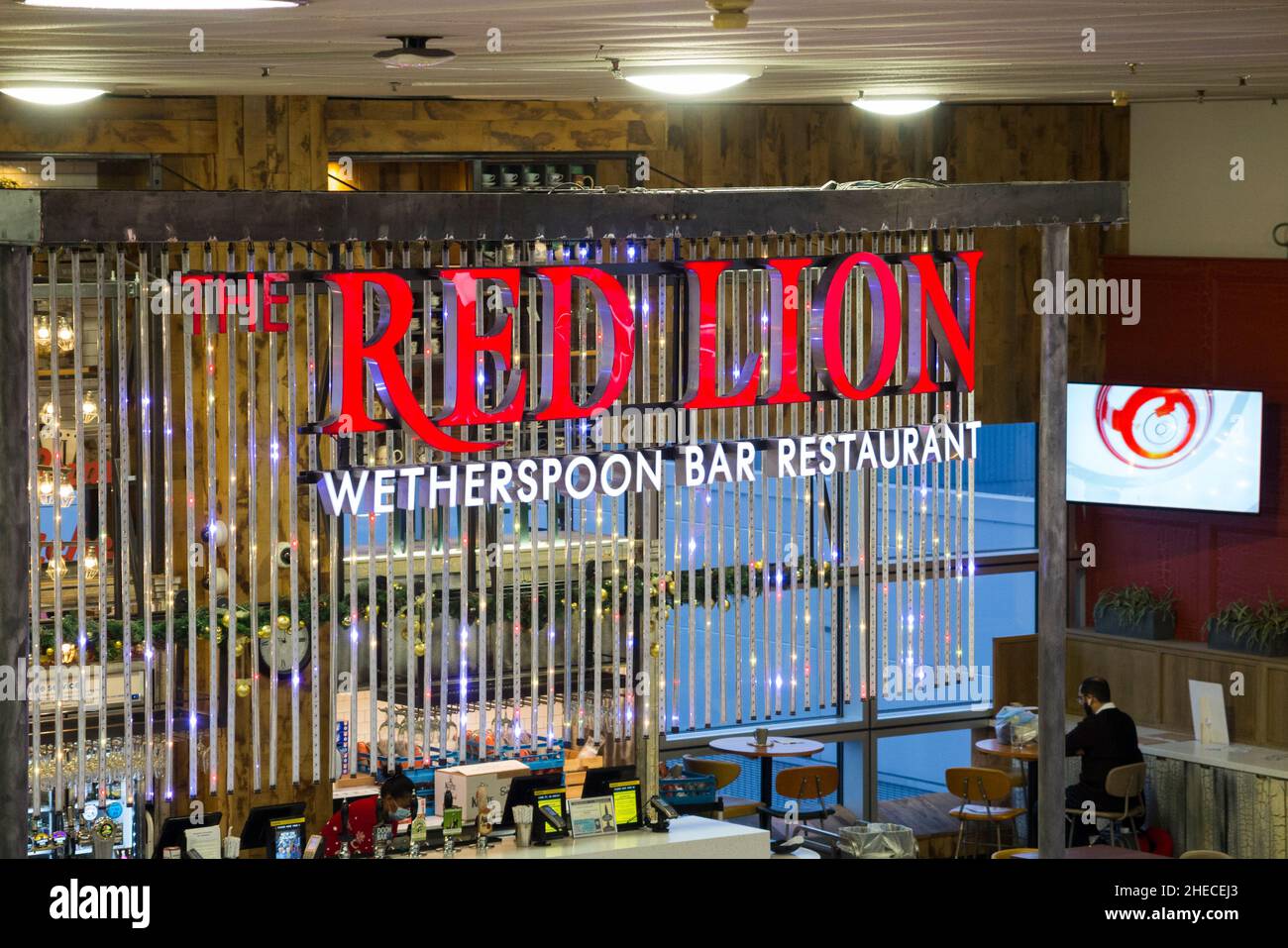 Sign / signage at The Red Lion Wetherspoon / Wetherspoons Pub / restaurant / Public House, at London Gatwick airport North Terminal, Crawley. UK. (128) Stock Photo