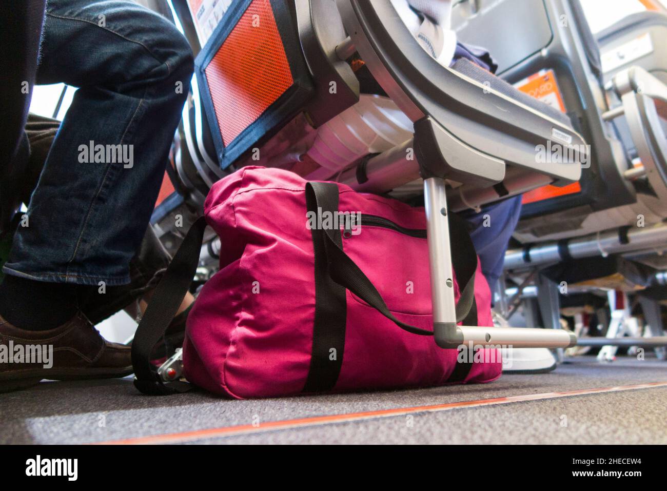 Bag under passenger seat storage area for passengers for stowing hand  luggage bags & carry on cabin baggage item. Easyjet Airbus A320 / A319  plane. (128 Stock Photo - Alamy