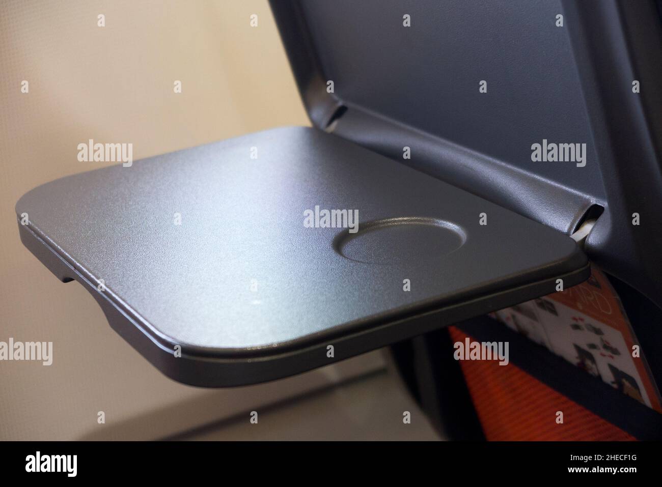 Passenger seat tray table in the full down position ready for use, on