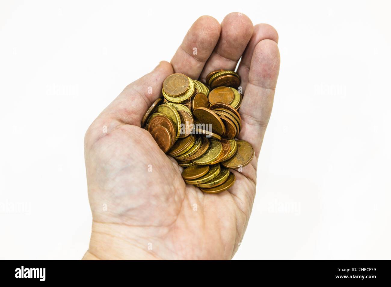 hand holding euro coins on white background Stock Photo - Alamy