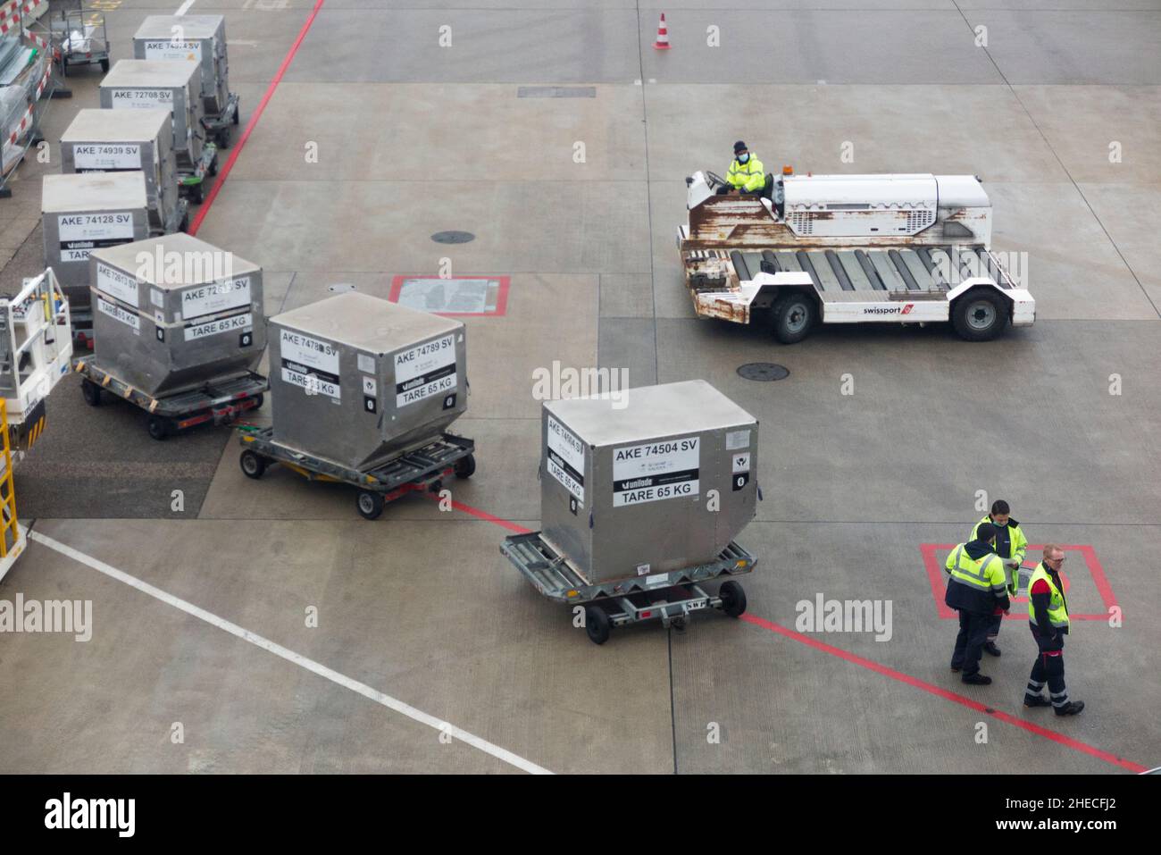 Ground crew or baggage handlers with Airport Ground Support Equipment