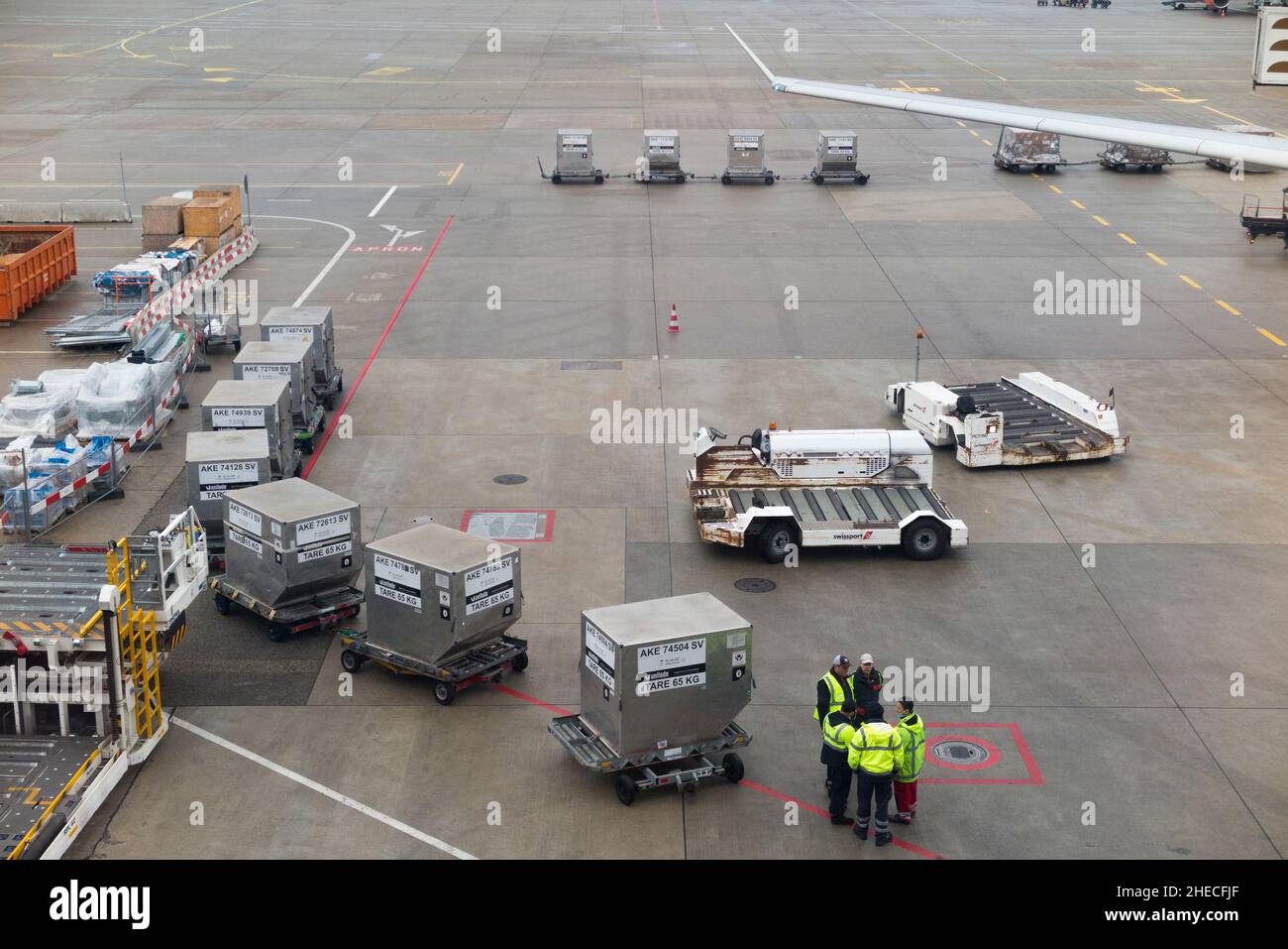 Ground crew or baggage handlers with Airport Ground Support Equipment
