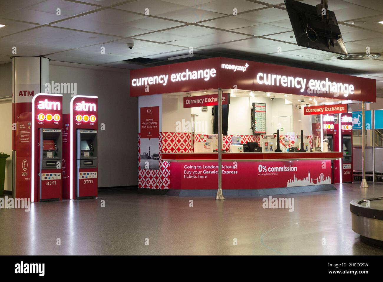 Moneycorp Bureau de Change currency exchange office with ATM machine  located in baggage reclaim hall. Gatwick airport North Terminal. London.  UK. (128 Stock Photo - Alamy
