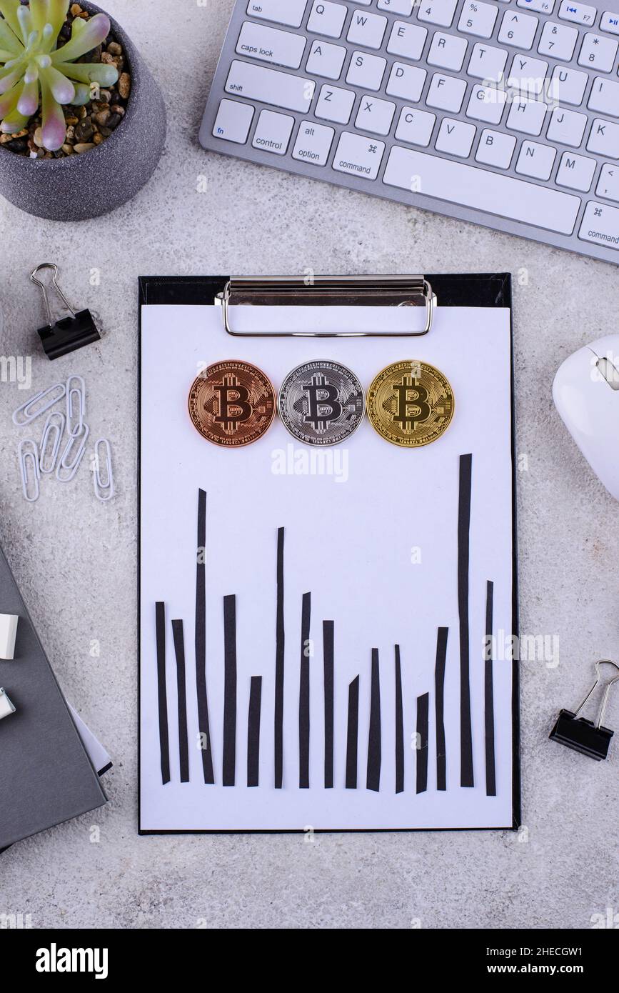 Bitcoin shedule on desk. Cryptocurrency concept Stock Photo